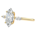 Detailed side view of a marquise three-stone ring with protective V-prong settings on all tips for daily durability.