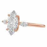 Elegant triple marquise engagement ring showing the dramatic elongating effect and modern leafy silhouette. ApolloGem