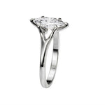 Symmetrical top-down view of a marquise moissanite solitaire in a polished white gold setting.