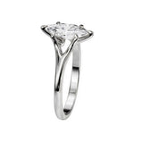 Symmetrical top-down view of a marquise moissanite solitaire in a polished white gold setting.