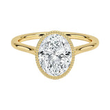 Oval shape Moissanite lab grown diamond engagement ring round shank with a bezel setting, on a gold band, against a white background.Moissanite engagement ring cape town south africa grand diamonds ralph jacobs jeulia 