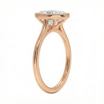 Rose gold ring with a diamond on a white background