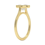 Oval shape Moissanite lab grown diamond engagement ring round shank with a bezel setting, on a gold band, against a white background.Moissanite engagement ring cape town south africa grand diamonds ralph jacobs jeulia 