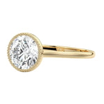 Round cut bezel engagement ring with milgrain beaded edge yellow gold South Africa