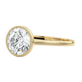 Round cut bezel engagement ring with milgrain beaded edge yellow gold South Africa