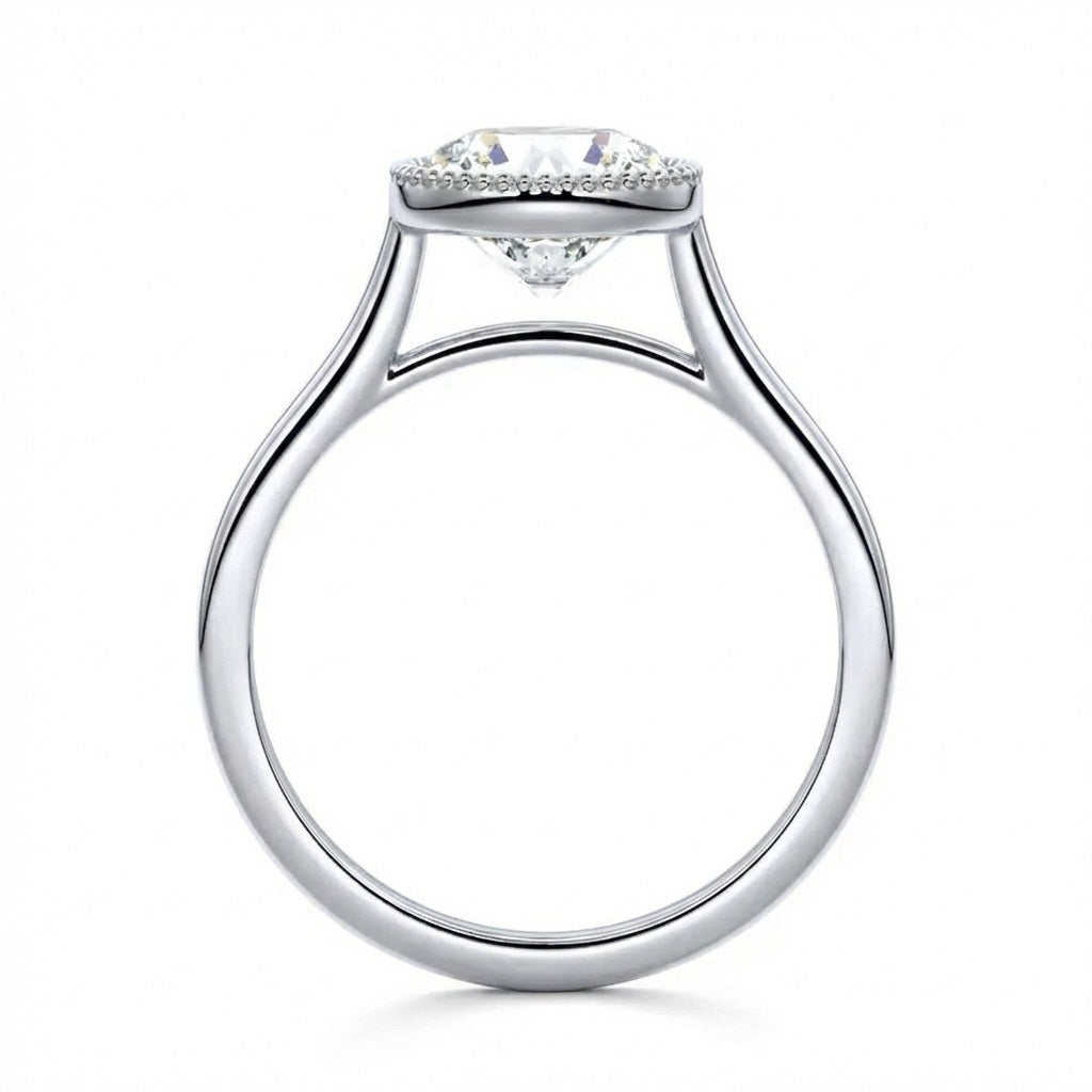 Milgrain detail on gold bezel setting round brilliant stone VVS clarity close up