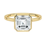 The Modern Asscher cut moissanite ring with a smooth yellow gold bezel ApolloGem
