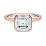The Modern Asscher cut moissanite ring with a smooth rose gold bezel ApolloGem