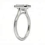 Top-down view of a D-color VVS1 emerald stone in a polished white gold bezel setting
