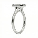 Top-down view of a D-color VVS1 emerald stone in a polished white gold bezel setting
