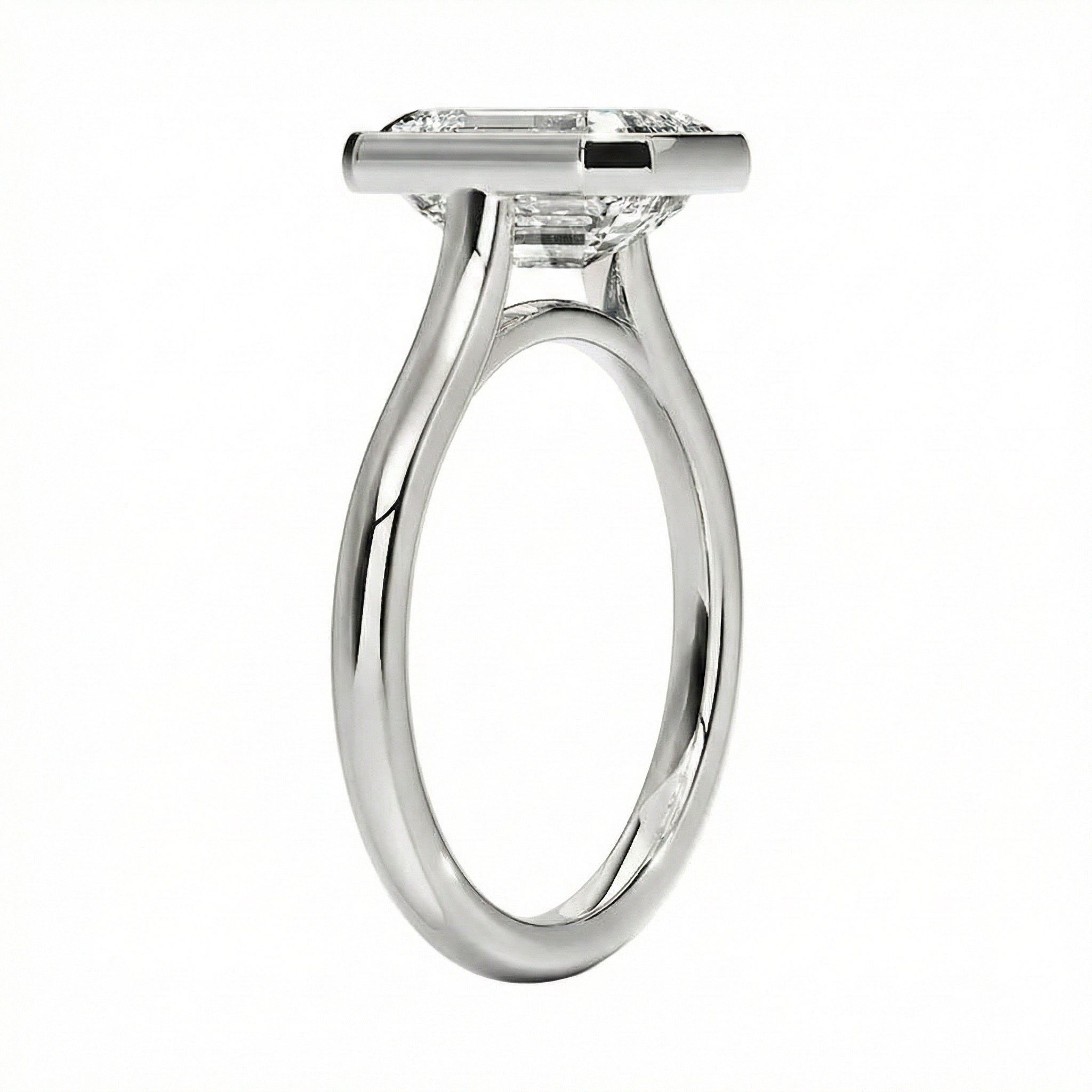 Top-down view of a D-color VVS1 emerald stone in a polished white gold bezel setting