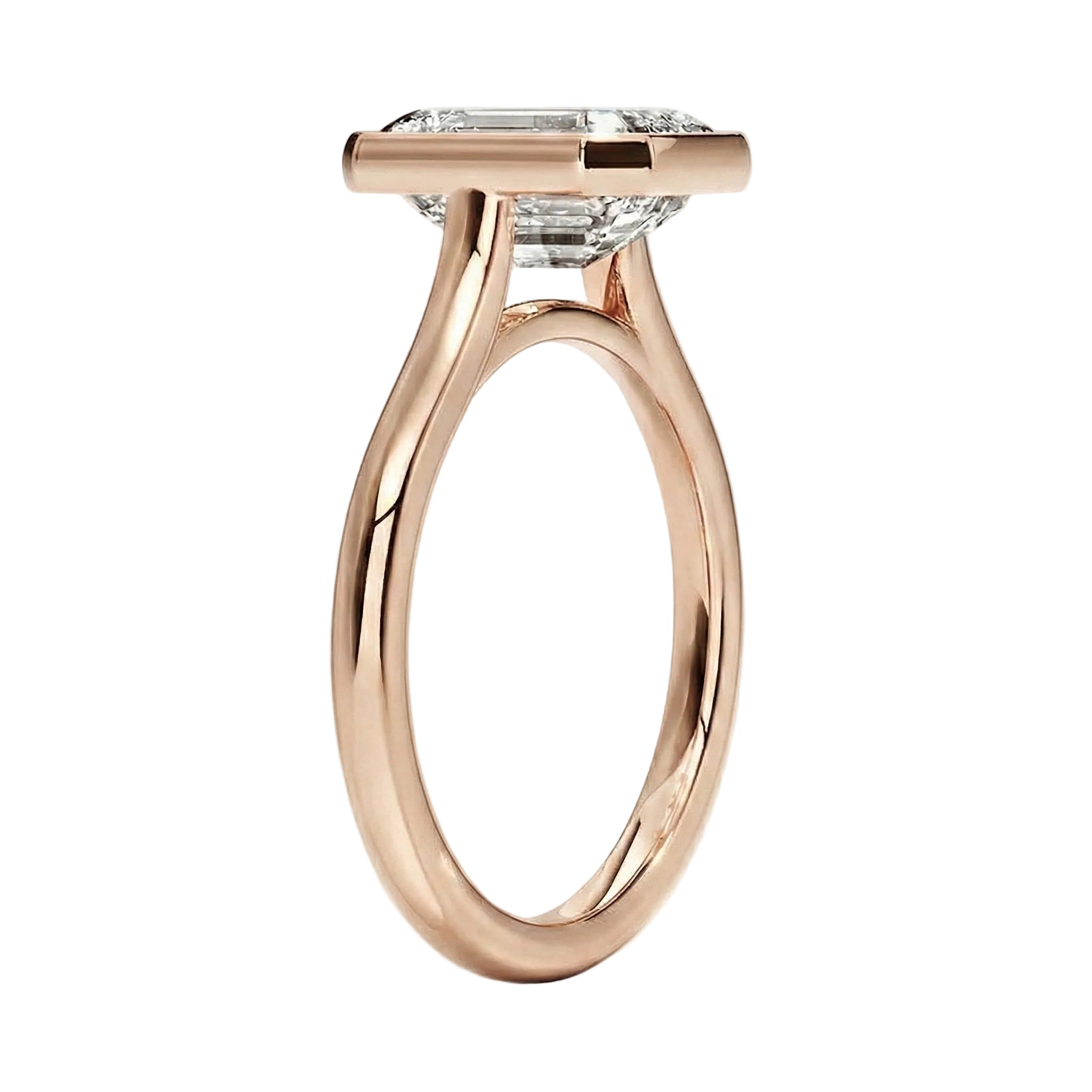 Top-down view of a D-color VVS1 emerald stone in a polished rose gold bezel setting