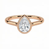 The Modern Pear cut moissanite ring with a smooth gold bezel ApolloGem
