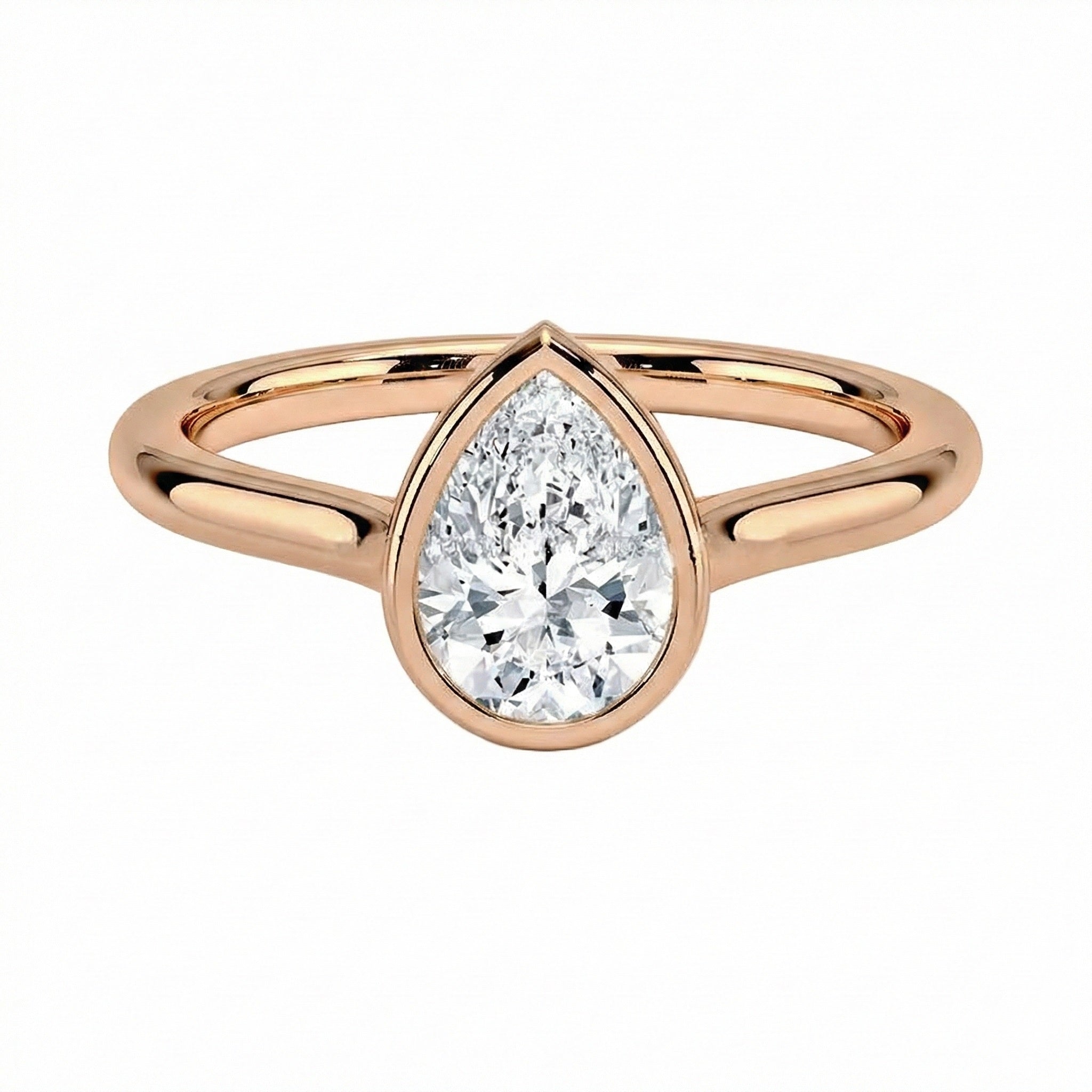 The Modern Pear cut moissanite ring with a smooth gold bezel ApolloGem
