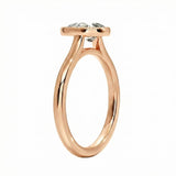 Top-down view of a D-color VVS1 pear stone in a polished gold bezel setting