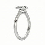 Top-down view of a D-color VVS1 pear stone in a polished gold bezel setting