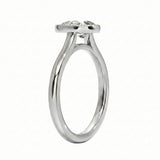 Top-down view of a D-color VVS1 pear stone in a polished gold bezel setting