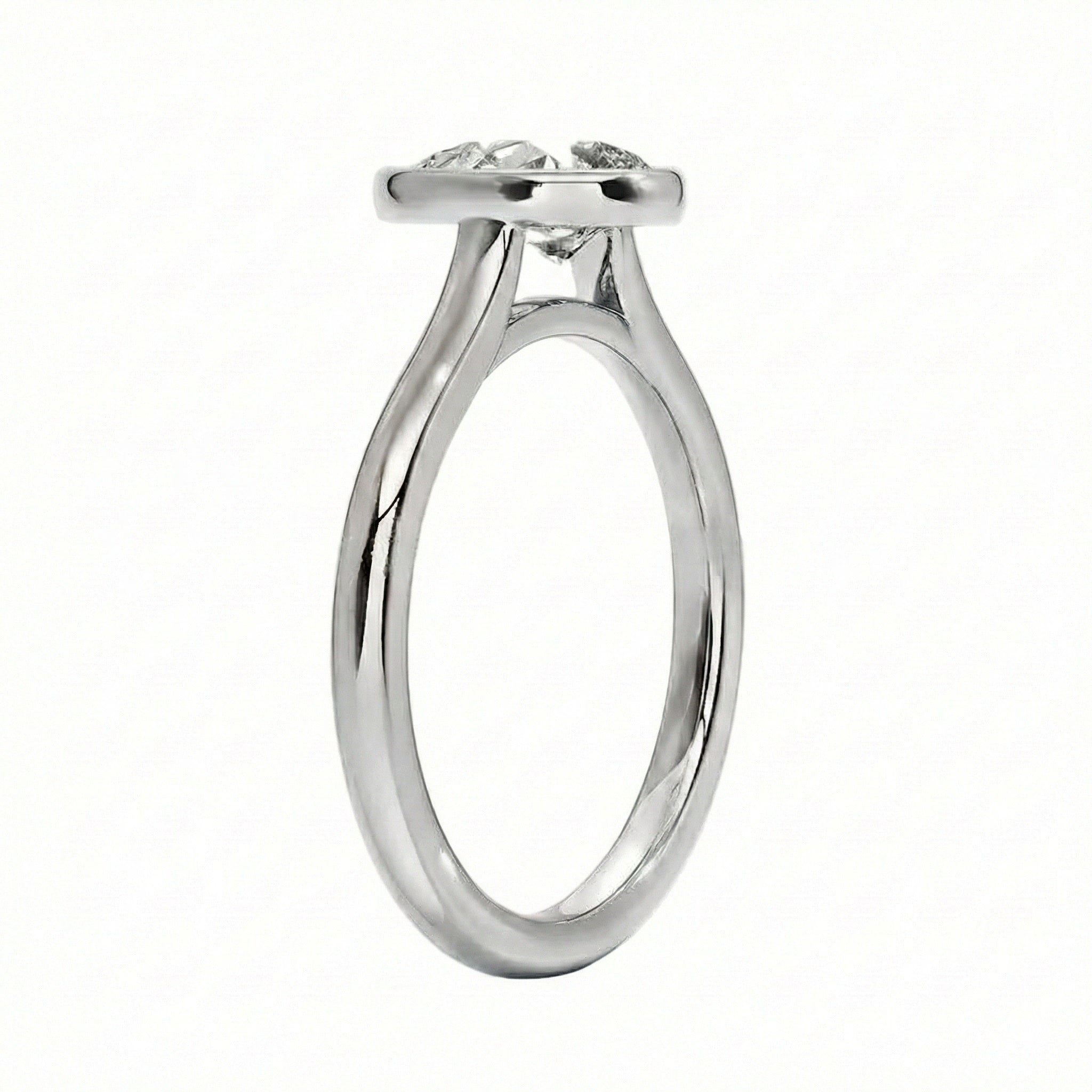 Top-down view of a D-color VVS1 pear stone in a polished gold bezel setting