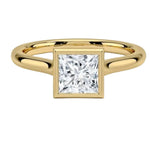 Modern bezel set princess cut moissanite solitaire ring in yellow gold ApolloGem