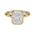 The Modern Radiant cut moissanite solitaire ring with a smooth yellow gold bezel ApolloGem