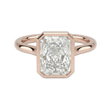 The Modern Radiant cut moissanite solitaire ring with a smooth rose gold bezel ApolloGem