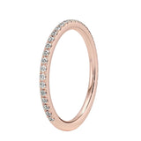 Rose gold ring with small diamonds on a white background
