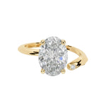 Luxury oval cut moissanite engagement ring with a modern bypass asymmetrical band in yellow gold ApolloGem South Africa.
