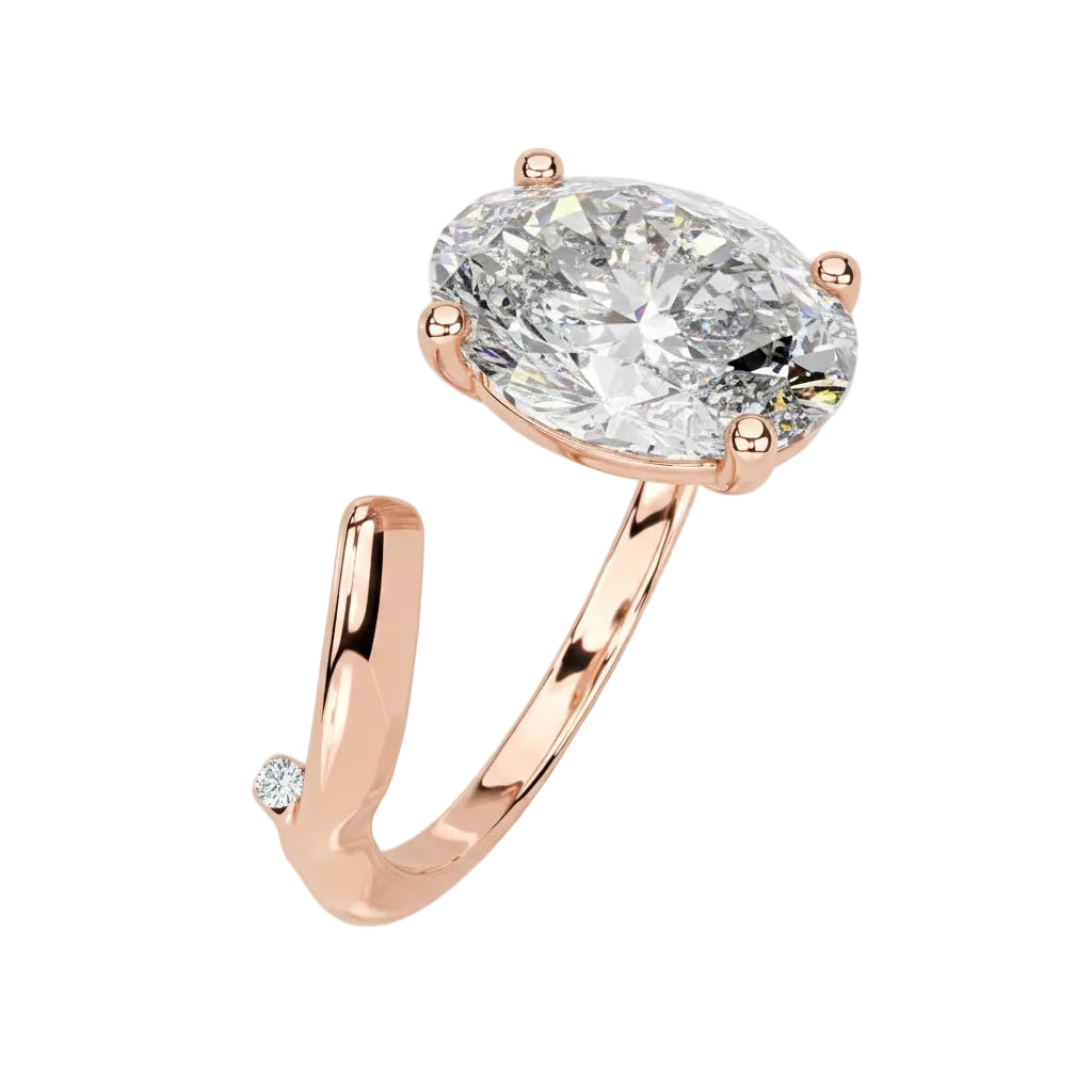 Close-up of a high-quality D-color VVS1 oval moissanite center stone on an artistic rose gold band.