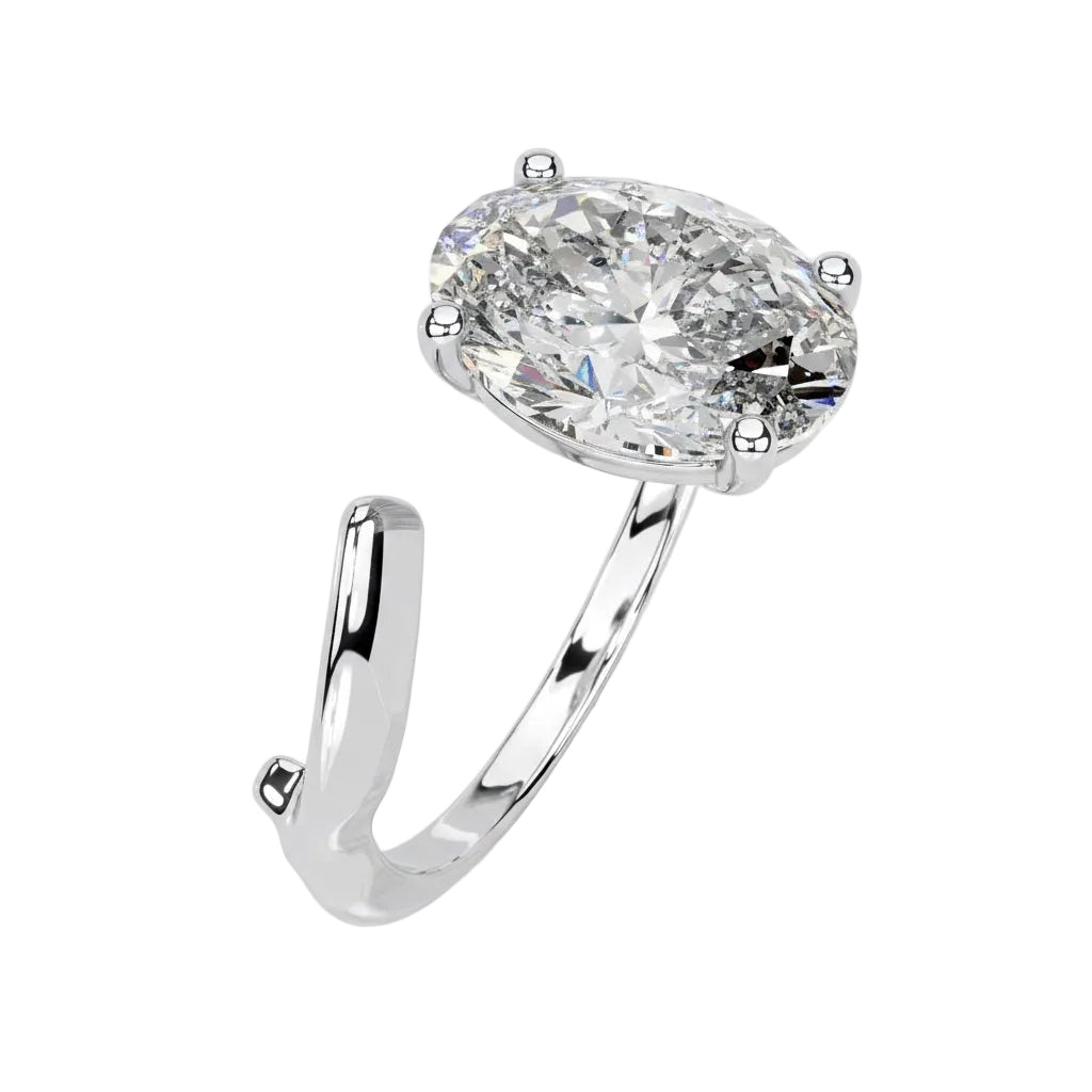 Close-up of a high-quality D-color VVS1 oval moissanite center stone on an artistic white gold band.