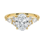 Luxury oval cut moissanite engagement ring in yellow gold featuring an organic cluster of round and marquise side stones ApolloGem South Africa.