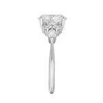 Close-up of a high-quality D-color VVS1 oval moissanite center stone with brilliant round and marquise accents guaranteed by GRI.
