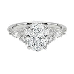 Diamond ring with a central gemstone and smaller stones on a white background