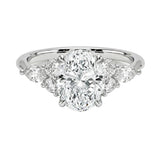 Diamond ring with a central gemstone and smaller stones on a white background