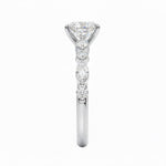 Oval cut Moissanite lab grown diamond engagement ring with tube set small round moissanites on the shank, on a gold band, against a white background.Moissanite engagement ring cape town south africa grand diamonds ralph jacobs jeulia 