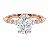Oval cut Moissanite lab grown diamond engagement ring with tube set small round moissanites on the shank, on a gold band, against a white background.Moissanite engagement ring cape town south africa grand diamonds ralph jacobs jeulia 