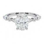Oval cut Moissanite lab grown diamond engagement ring with tube set small round moissanites on the shank, on a gold band, against a white background.Moissanite engagement ring cape town south africa grand diamonds ralph jacobs jeulia 