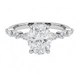 Oval cut Moissanite lab grown diamond engagement ring with tube set small round moissanites on the shank, on a gold band, against a white background.Moissanite engagement ring cape town south africa grand diamonds ralph jacobs jeulia 