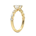 Oval cut Moissanite lab grown diamond engagement ring with tube set small round moissanites on the shank, on a gold band, against a white background.Moissanite engagement ring cape town south africa grand diamonds ralph jacobs jeulia 