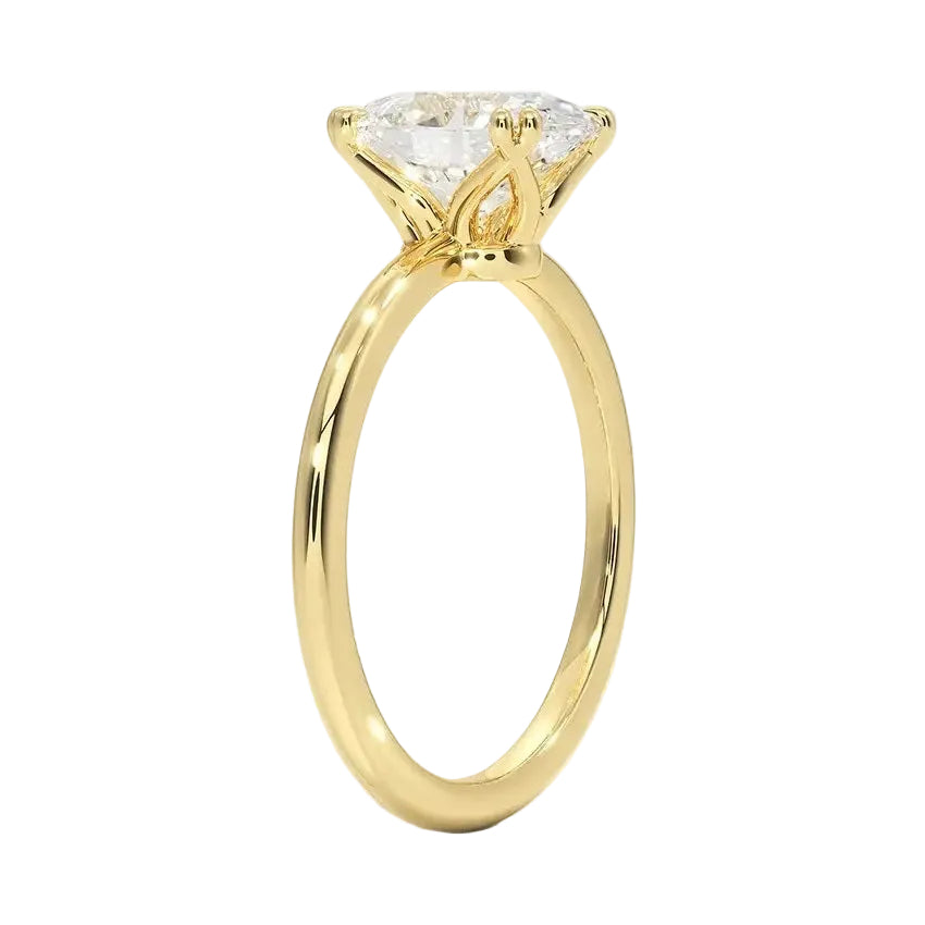 Oval cut Moissanite lab grown diamond engagement ring round shank with double cat claw setting, on a gold band, against a white background.Moissanite engagement ring cape town south africa grand diamonds ralph jacobs jeulia 
