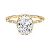 Luxury oval cut moissanite engagement ring in 9ct yellow gold with a double hidden halo and pavé band.