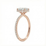 Side profile of a rose gold engagement ring featuring double hidden halos and diamond-encrusted cat claws.