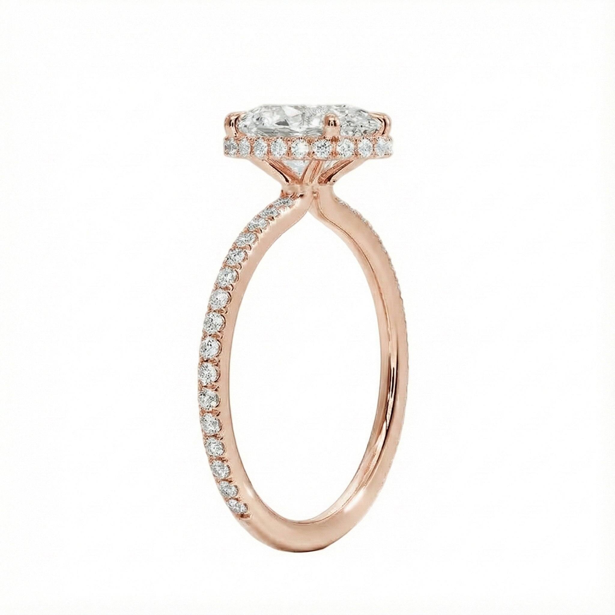 Side profile of a rose gold engagement ring featuring double hidden halos and diamond-encrusted cat claws.