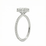 Side profile of a white gold engagement ring featuring double hidden halos and diamond-encrusted cat claws.