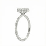 Side profile of a white gold engagement ring featuring double hidden halos and diamond-encrusted cat claws.