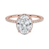 Luxury oval cut moissanite engagement ring in 9ct rose gold with a double hidden halo and pavé band.