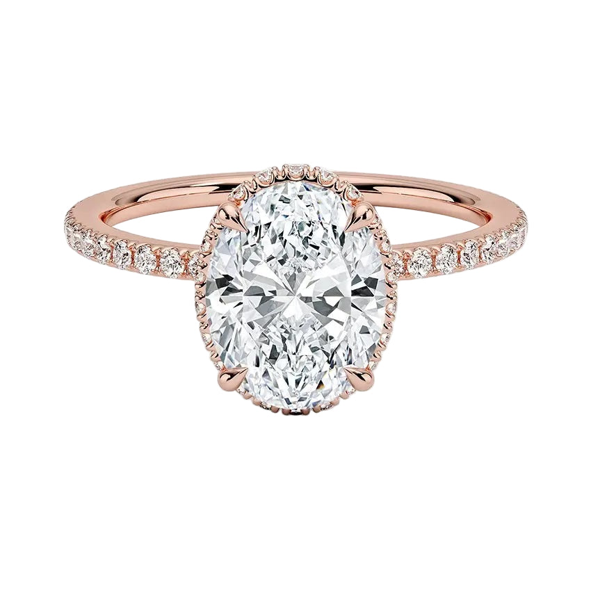Luxury oval cut moissanite engagement ring in 9ct rose gold with a double hidden halo and pavé band.
