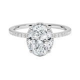 Luxury oval cut moissanite engagement ring in 9ct white gold with a double hidden halo and pavé band.