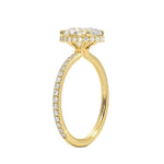 Side profile of a yellow gold engagement ring featuring double hidden halos and diamond-encrusted cat claws.