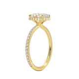 Side profile of a yellow gold engagement ring featuring double hidden halos and diamond-encrusted cat claws.