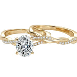 Oval moissanite engagement ring with matching twisted infinity wedding band Duo Collection ApolloGem.
